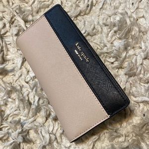 Only used once. Kate Spade wallet in cream with black